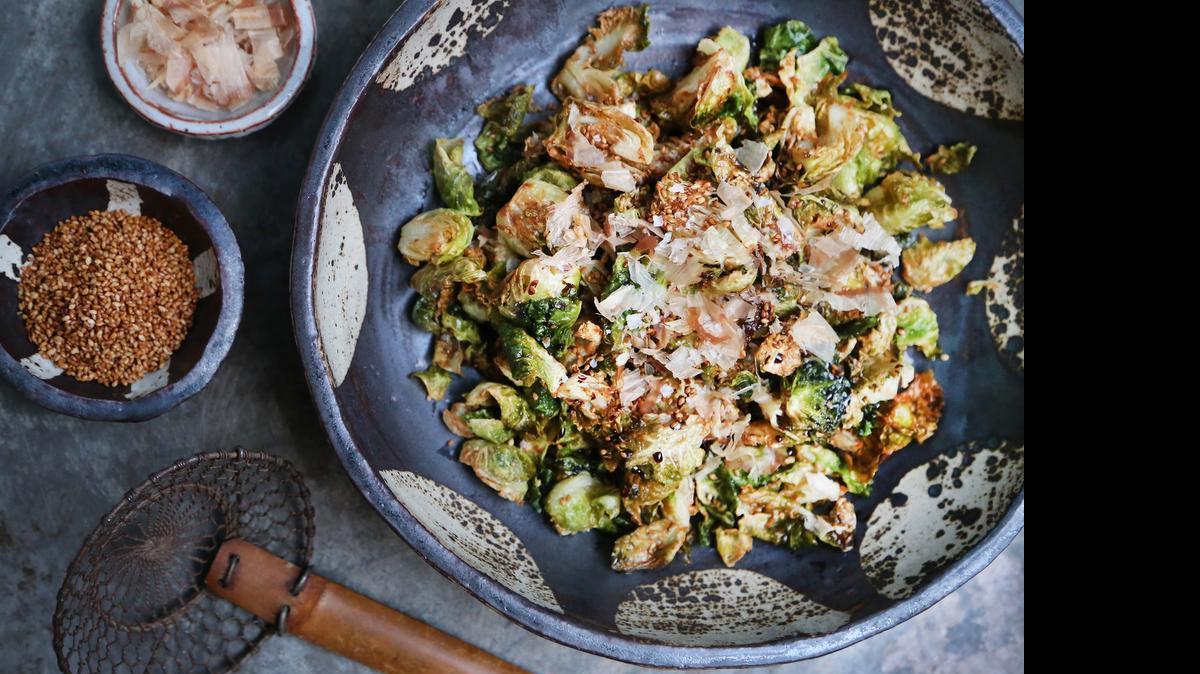 Bonito flakes and kecap manis are the keys to Futo Buta’s Brussels sprouts. The pottery in the picture is made by Asheville artist Melissa Weiss and is available at Lark & Key Gallery in Charlotte.
