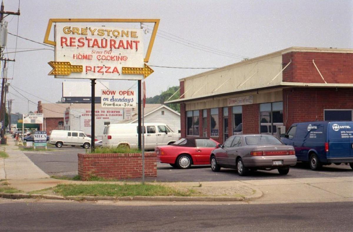 The Greystone in the mid-1990s, before the original building was replaced with a small shopping center.