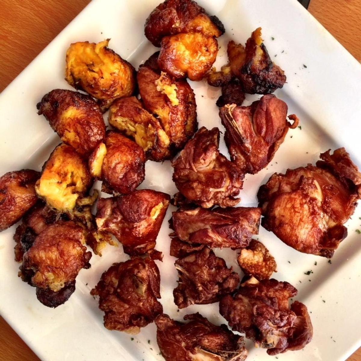 At Punta Cana, fried chicken comes as short bone-in pieces with fried plantains and a salad or rice and beans.