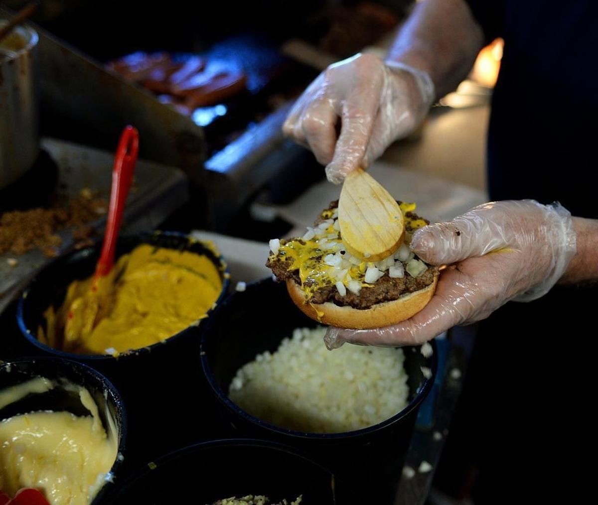 A cheeseburger made “all the way” with chili at Brooks’ Sandwich House.