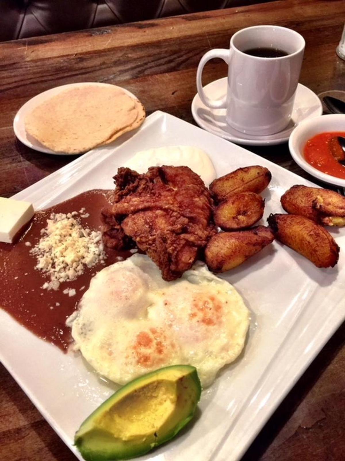 Fried chicken for breakfast at Morazan: You get two eggs, sweet plantains, avocado, refried beans and a big piece of beautifully fried chicken.
