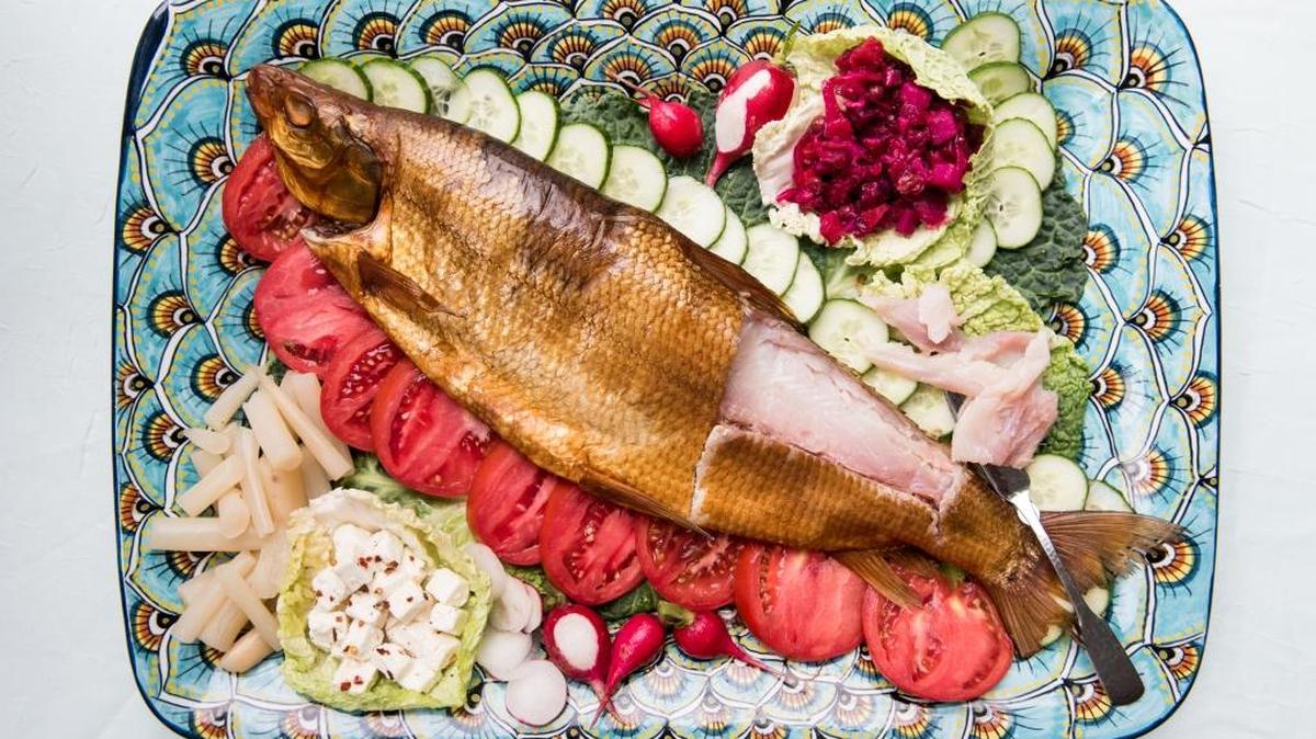 Even if you get smoked fish and salads from a deli, you can arrange them on your own platters. Figure 3 ounces of salads and 2 ounces of smoked fish per person.