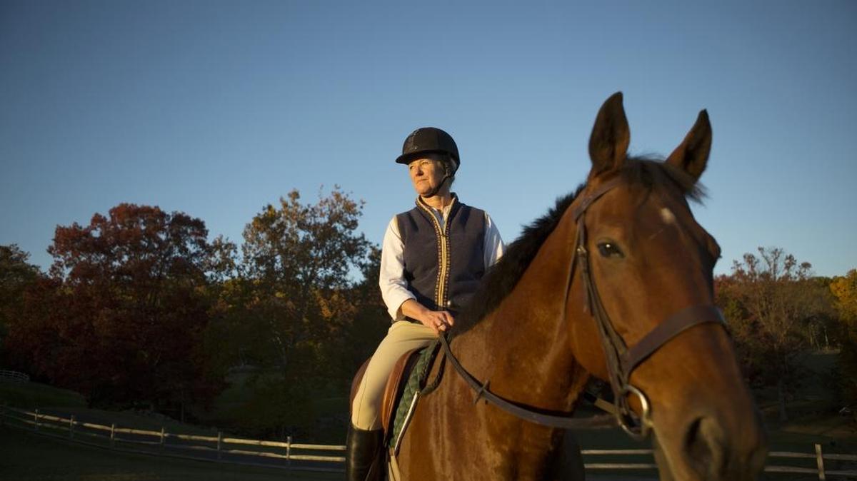 Hilary Stephens, who took up horseback riding again --which she had done as a kid -- after divorcing, on Stargazer at Peaceful Grazing Farm in New Hope, Penn., Oct. 26, 2015. While divorce rates have plateaued or dropped among other age groups, the rates are rising for those 50 and older.