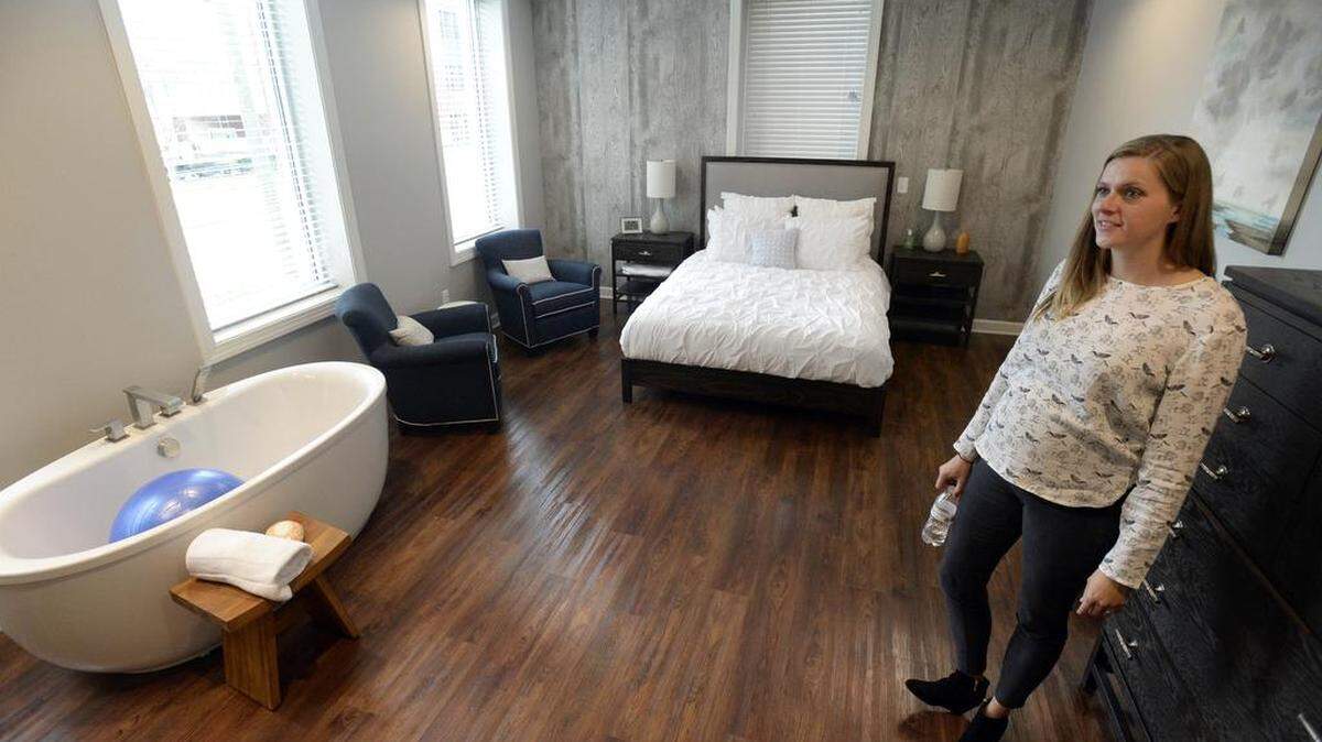 Stephanie Godfrey, a certified nurse midwife at Baby And Company in Charlotte gives a tour of a labor and delivery room at the new birth center on Providence Road. The freestanding center, a collaboration between Baby And Company and Novant Health, features rooms with soaking tubs for water births.
