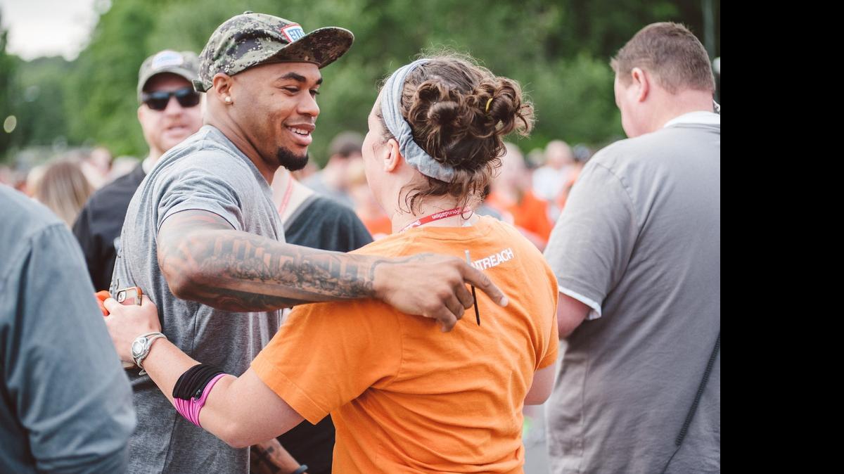 
Steve Smith of the Baltimore Ravens shares a hug with a runner at last year’s Lace Up Son Family 5K in Matthews.
