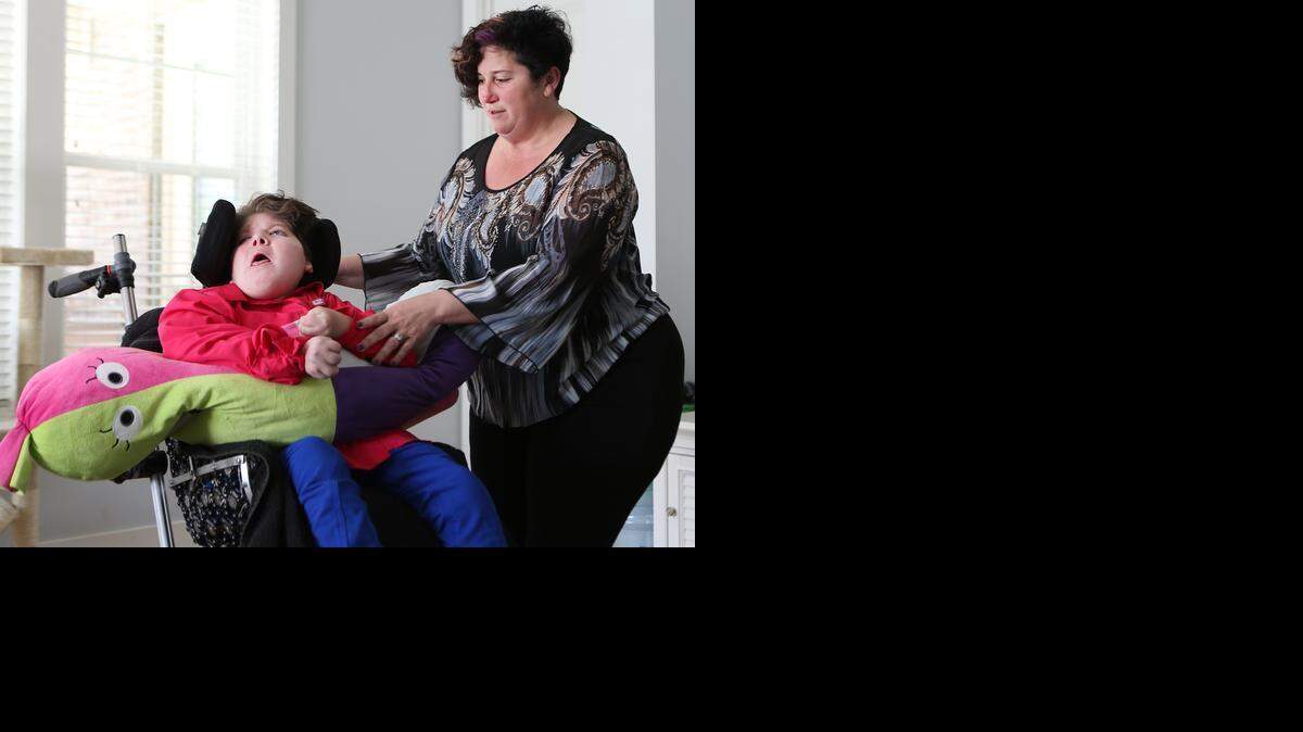 
Theresa Black, right, with her daughter, Angelica, at their home in Panama City Beach, Fla. Angelica, who is 14 now, was 3 months old when she was diagnosed with a brain injury.
