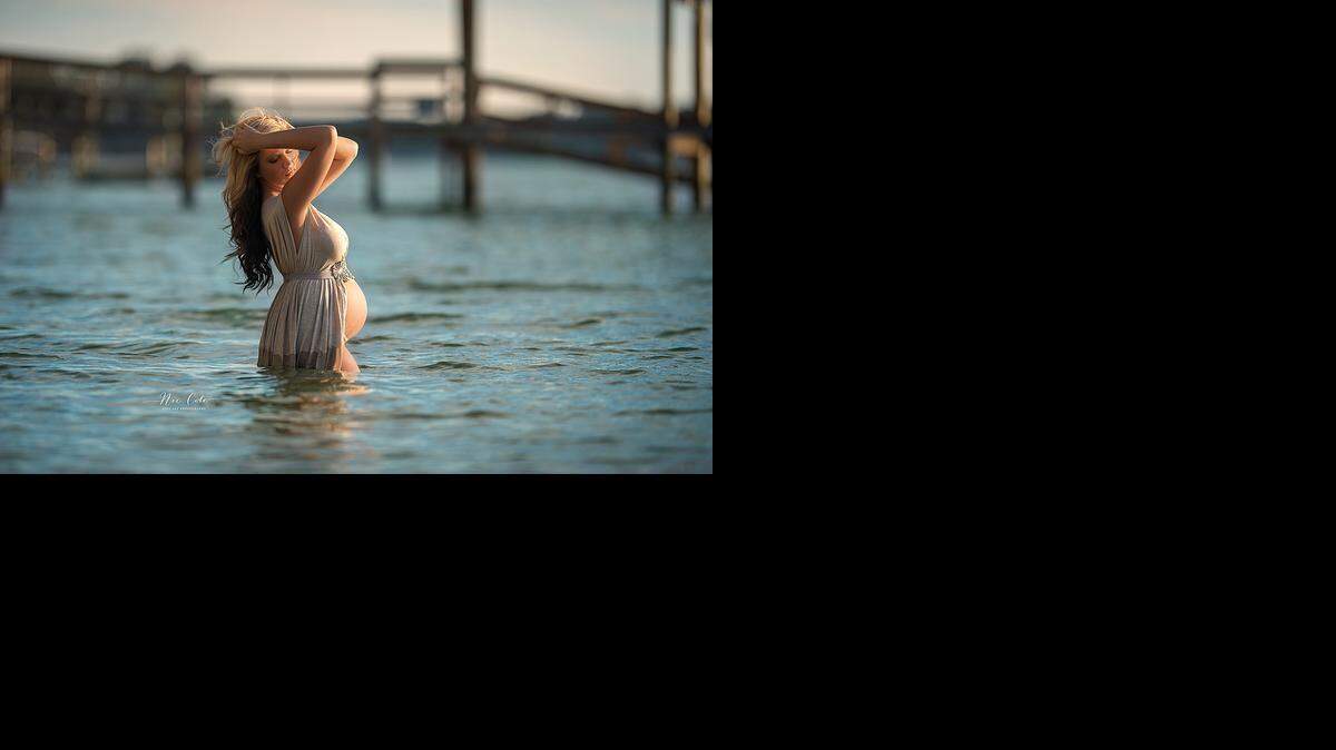 
Amber Alderman poses in Lake Wylie for her maternity photo shoot.
