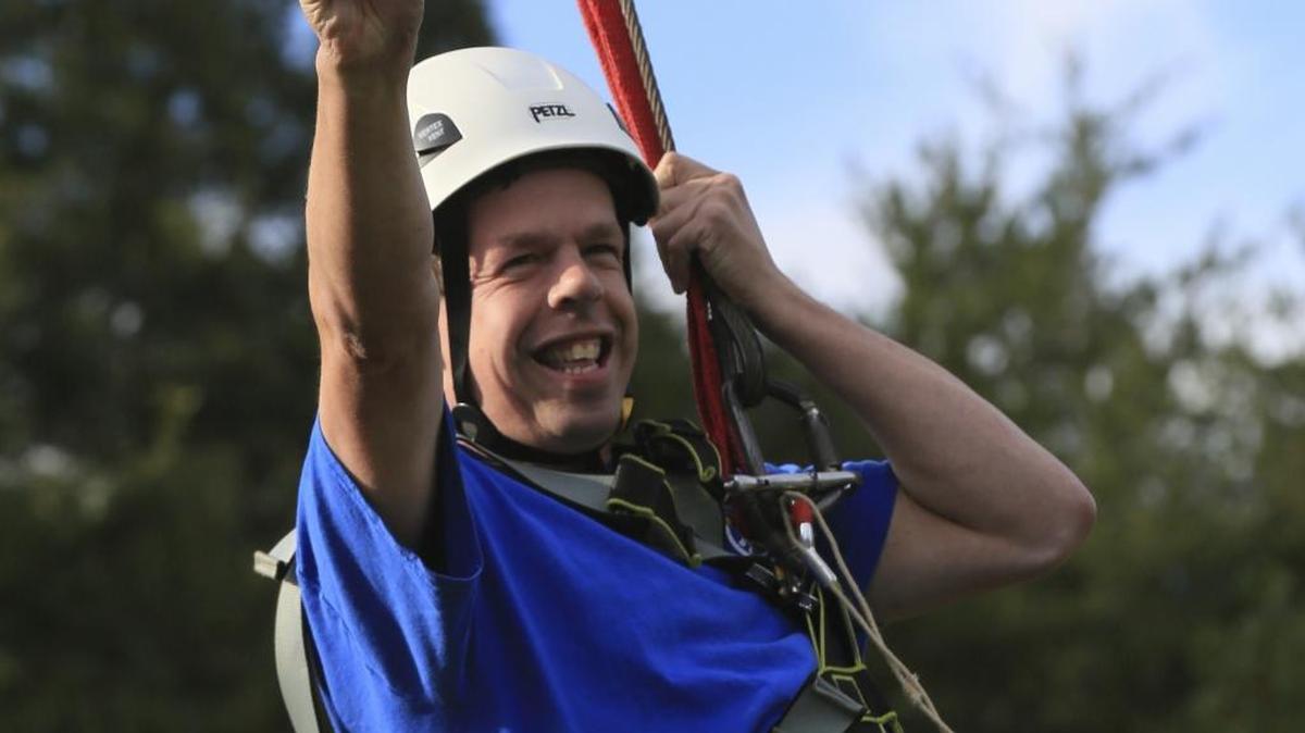 
Brent Sesler, son of Camp Blue Skies founder Dick Sesler, was born with Williams syndrome, a rare genetic disorder. Here he’s having fun at camp in October 2014.
