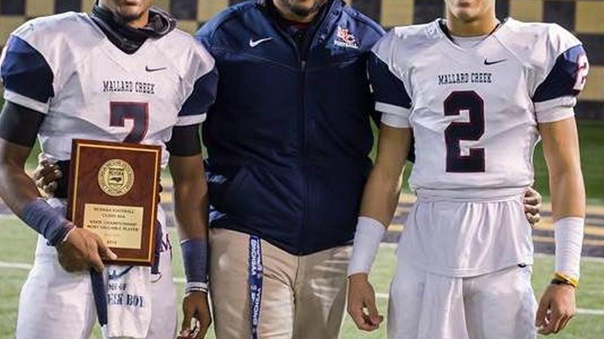
Mallard Creek High junior varsity coach Vinson Smith with players James Smith, left, and Javon Harbison.
