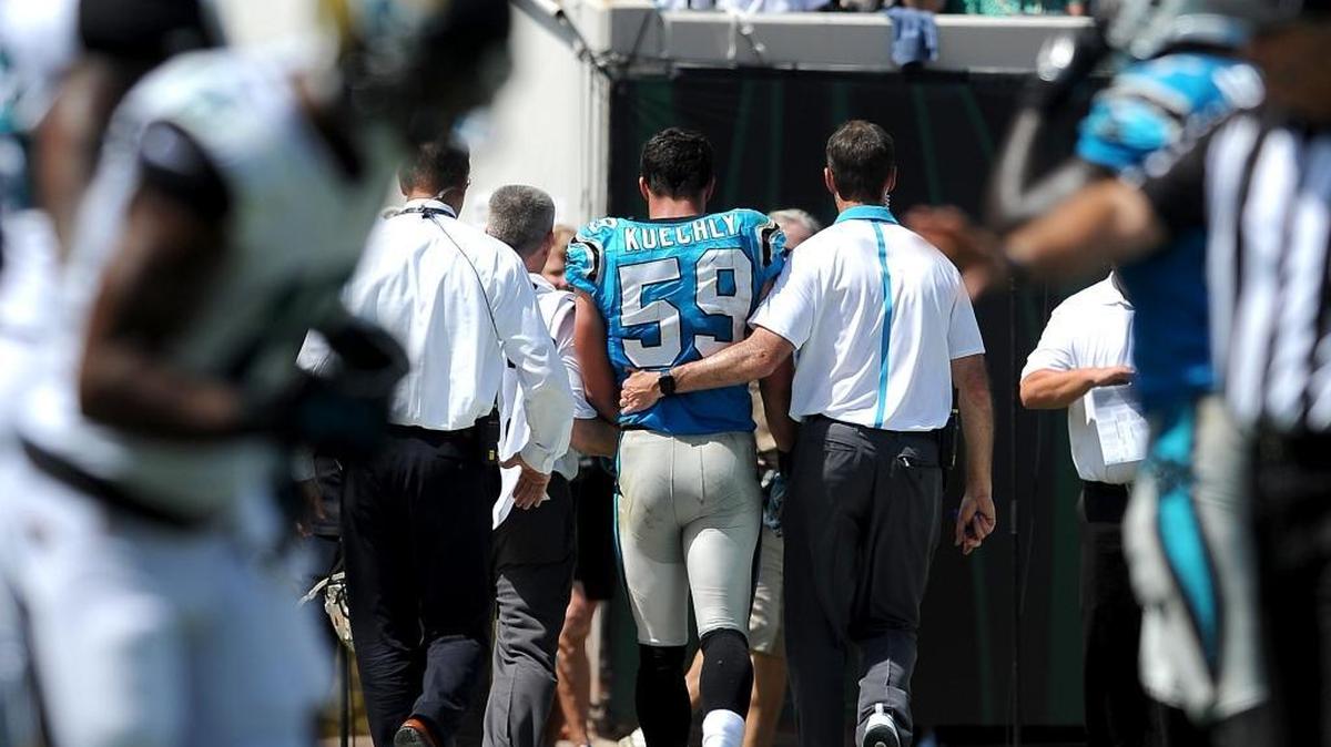 
Luke Kuechly is helped off the field after suffering a concussion Sept. 13.
