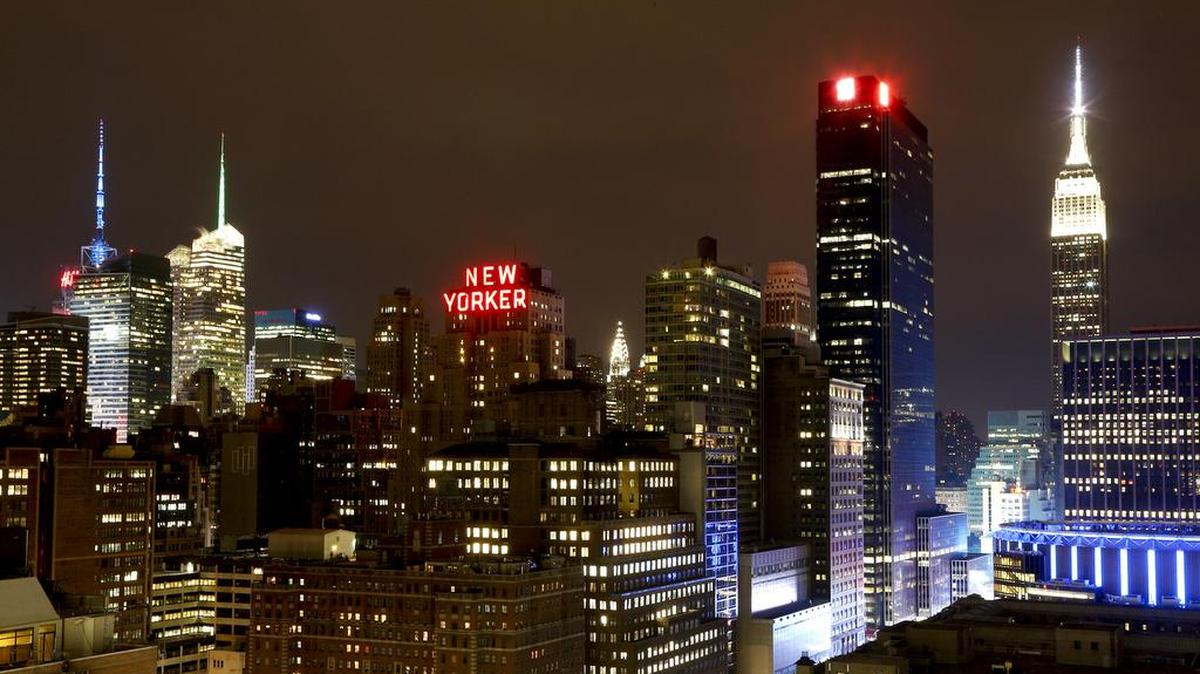 A piece of the Manhattan skyline, including the Empire State Building, right, glows on an overcast night, Thursday, May 14, 2015, in New York.
