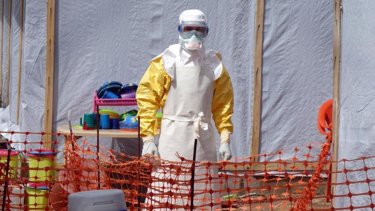 UNC-based physician Dr. William Fischer II wore extensive gear as he cared for Ebola patients in Gueckedou.