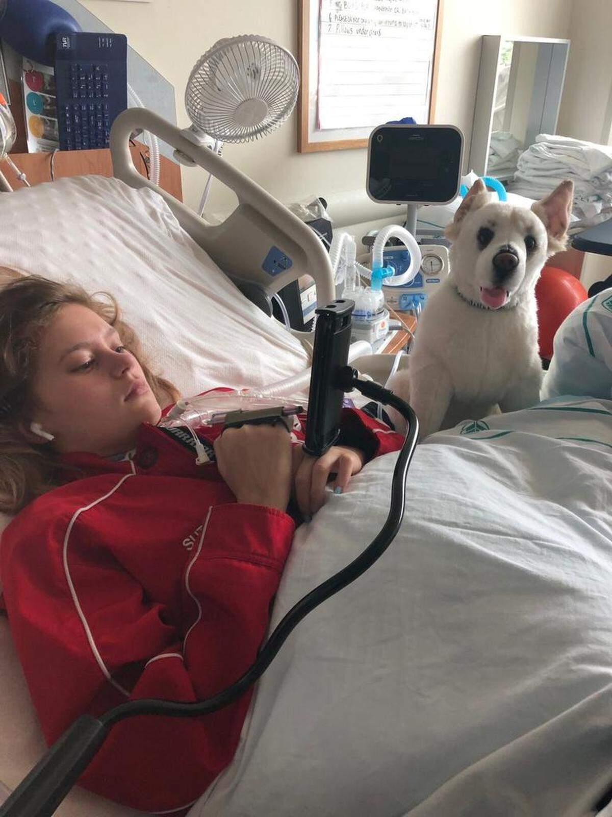 After being diagnosed with Guillain-Barré Syndrome and weeks of not being able to move in her hospital bed, her hands and arms started working well enough that she could hold a stylus up to her iPhone, which was affixed to her bedrail via a gooseneck-style holder.