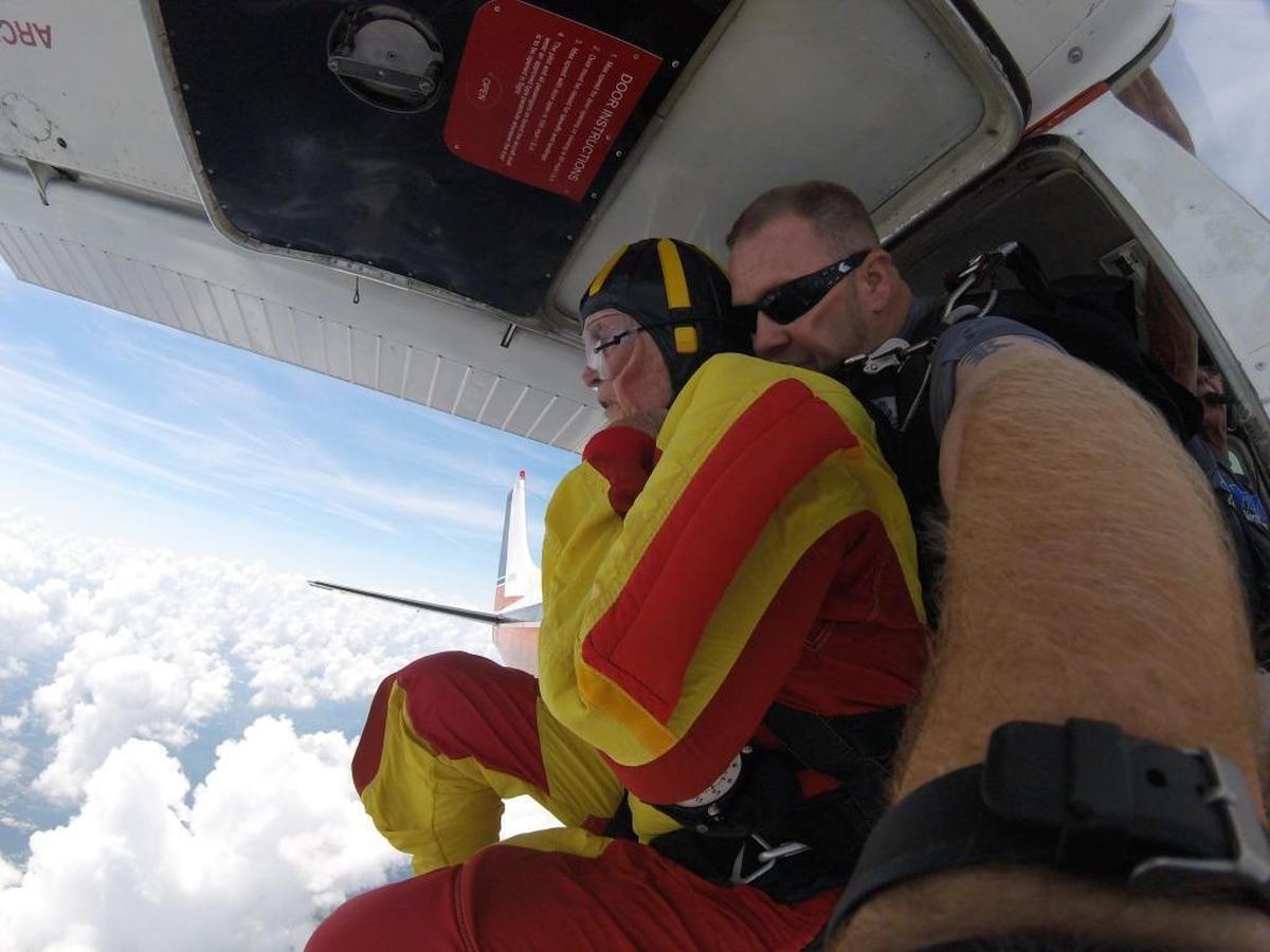 Jack Hart, shown here about to jump with Skydive Central North Carolina instructor Kelvin Wilkerson, says he used to be wary of heights. “But you grow into things, you know? There were some things I was afraid of, I guess, when I was a child that I got over.”