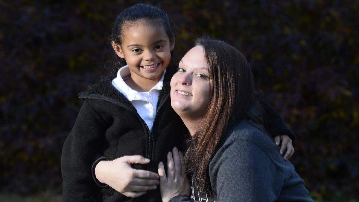 Chrystal Metcalf with her 5-year-old daughter Karen. Metcalf will wake up Christmas morning in a rehab housing program. This, she says, is a sign that her long troubled life is turning around.