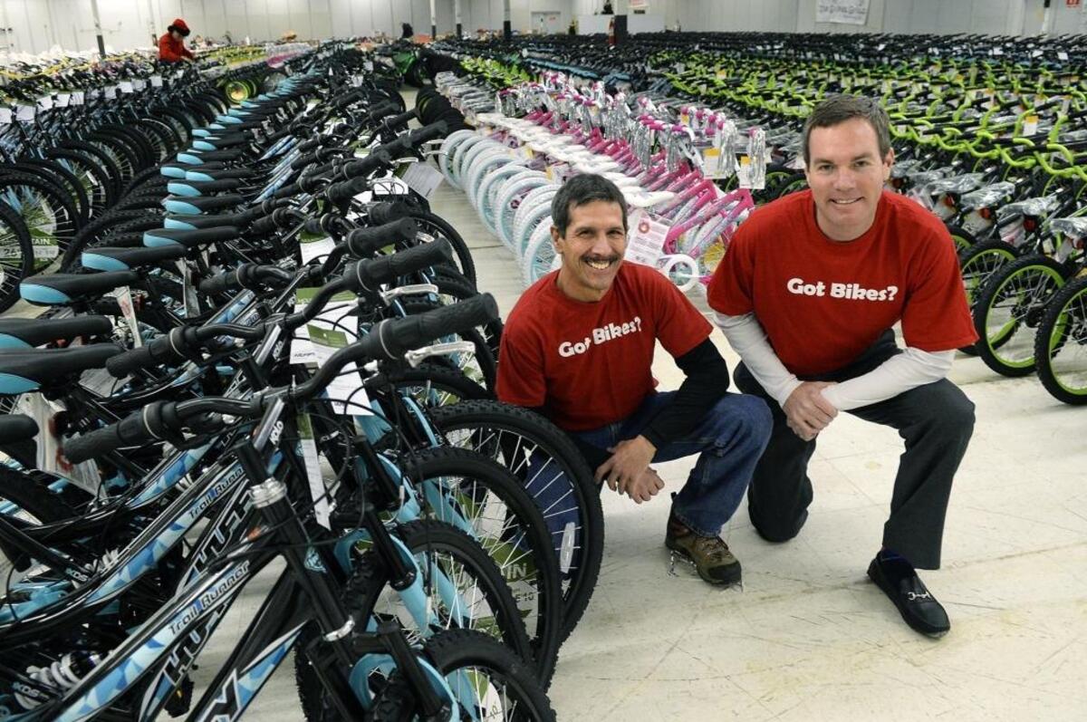 Dan Alion, left, the wheel coordinator, and Will Beard, director of The Spokes Group, helped gather and organize thousands of bicycles donated by the organization to the Salvation Army. The Salvation Army Angel Tree program had it’s annual kickoff on Friday. Needy families with children up to 12 years old in Mecklenburg and Union counties will get gifts, some even get bicycles, and food for Christmas.