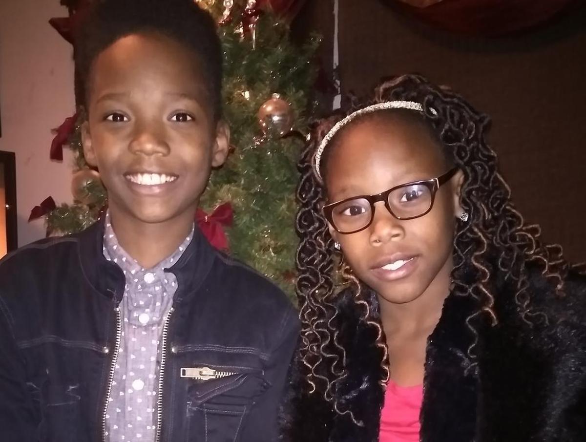 Xzabeon, left, and Kenyada Young smile in front of the tree on Christmas morning, after opening gifts from Santa. Their family received gifts and financial help this Christmas thanks to the Salvation Army and the Charlotte Observer’s Empty Stocking Fund.