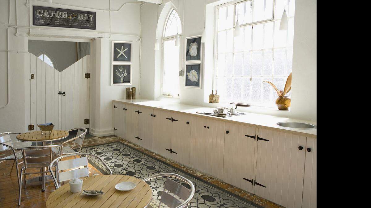 
 Non-slip vinyl floorcloths are perfect for kitchens, dining and outdoor spaces. The Holmes design by Spicher and Company is available in various sizes. 
