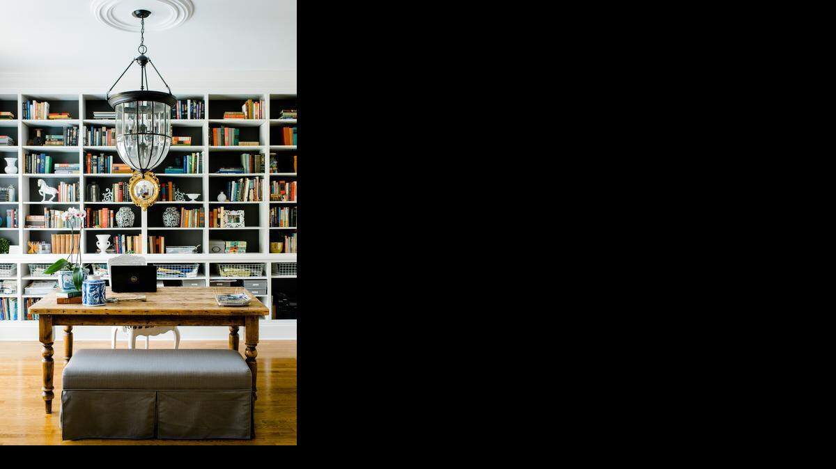 
Charlotte designer Emily Clark’s home office features a floor-to-ceiling library. 
