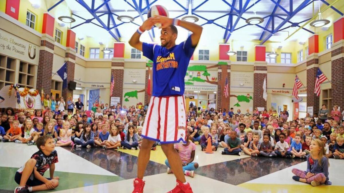 This file photo (from November 2016) shows Julian “Zeus” McClurkin of the Harlem Globetrotters demonstrating his ball-spinning skills after speaking to elementary schoolchildren in Irmo, S.C.
