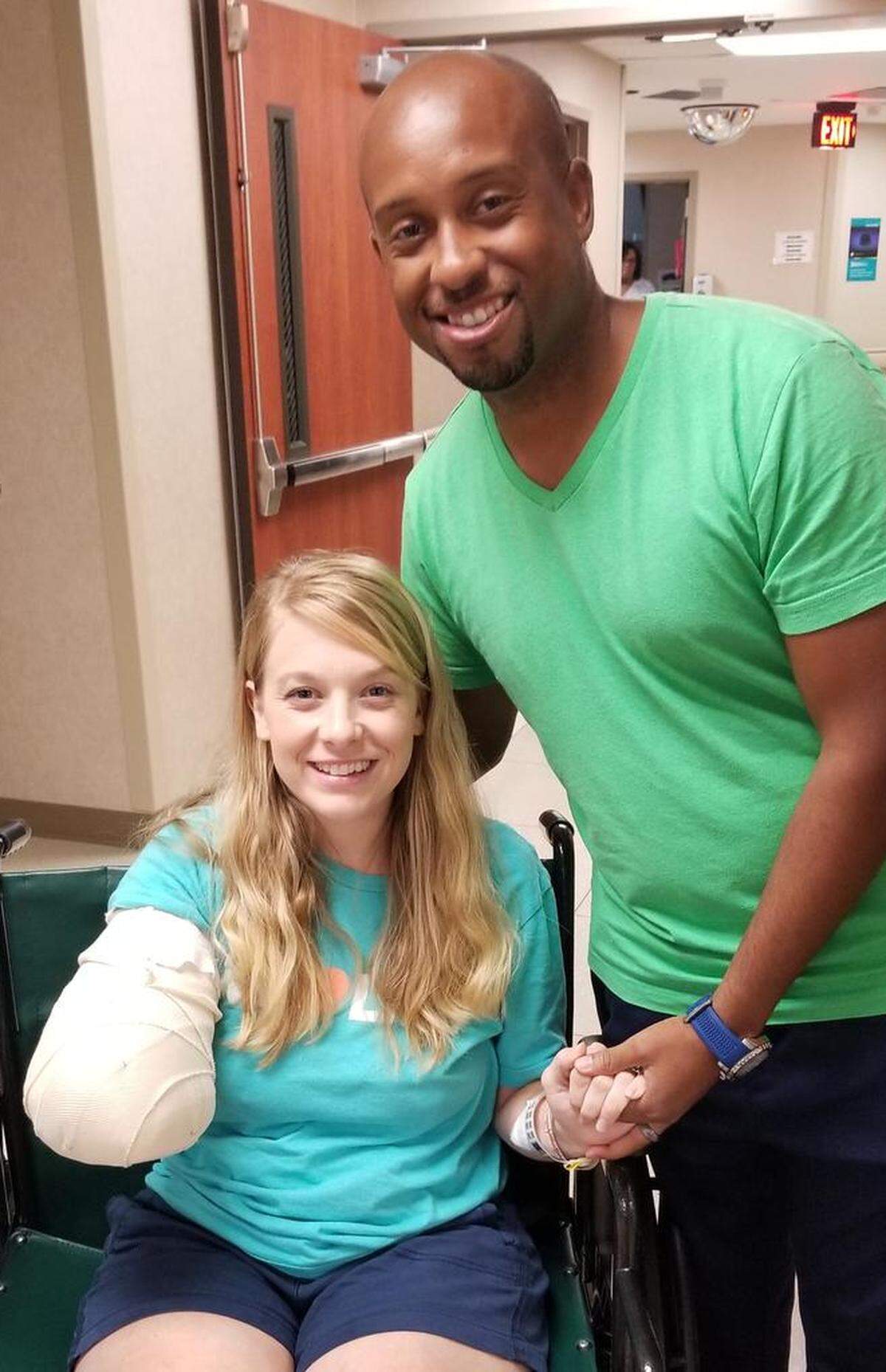 Tiffany Johnson and her husband J.J. smile for the camera right before being discharged from the hospital in Charlotte, four days after the attack.