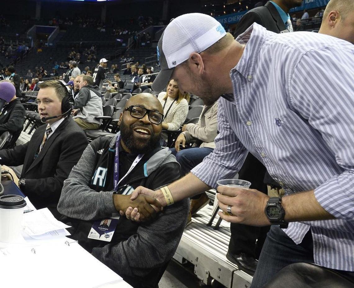 Hornets PA announcer Pat Doughty greets a fan in 2016.