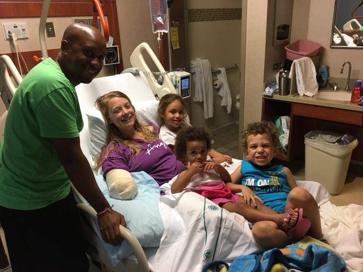 Tiffany Johnson with her family at the hospital in Charlotte, two days after the attack.