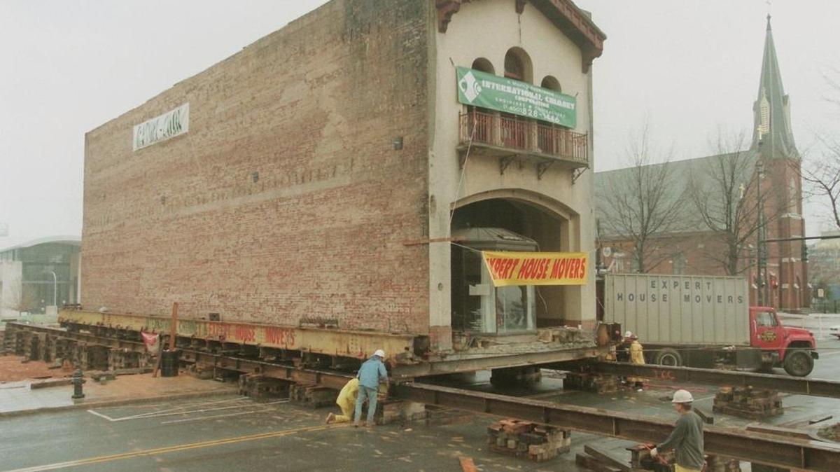 FILE--The Ratcliffe Florist building is pulled across Tryon St. Saturday morning March 4, 2000, in Charlotte, N.C. The building was moved to a parking lot across the street while an underground parking deck was constructed.(AP Photo/The Charlotte Observer, Jeff Siner)