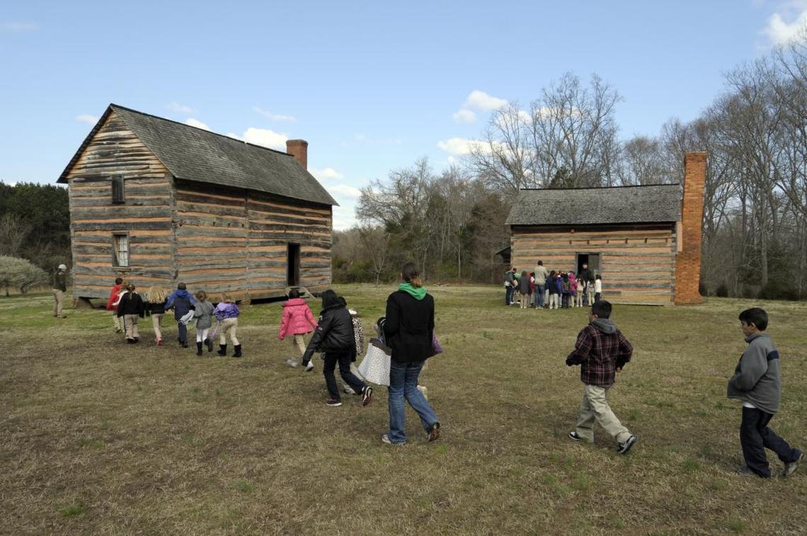 A group of elementary school students takes a tour of the James K. Polk historic site in Pineville.