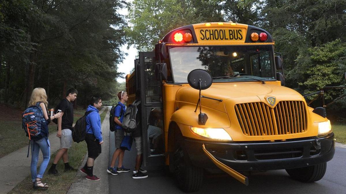 South Mecklenburg High School students board their school bus for the first day of school on Bevington Place in southeast Charlotte in 2016.