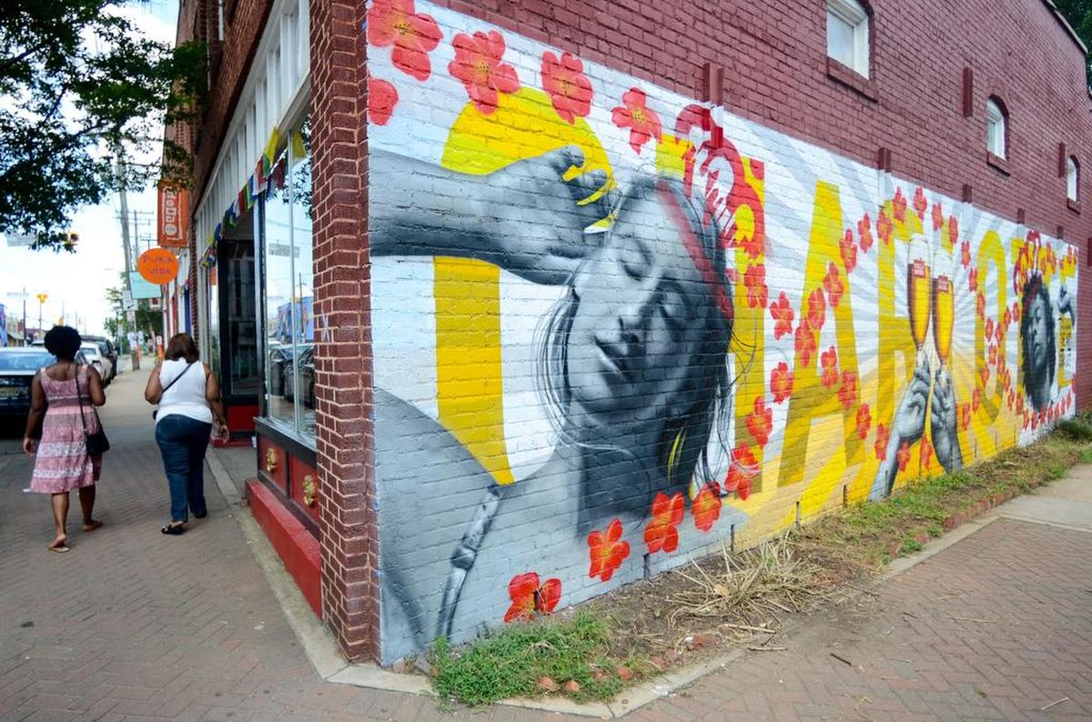 In NoDa, Charlotte’s arts district, it’s not unusual to find murals, like this one from Nicholas Napoletano, covering the sides of buildings.