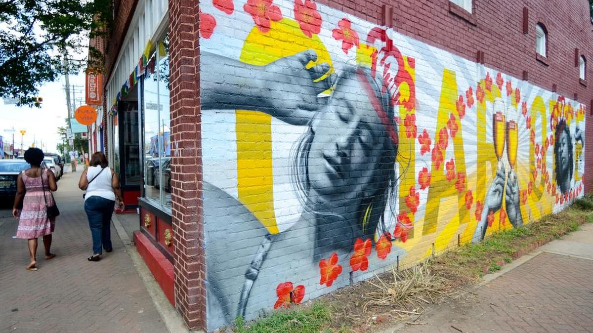 In NoDa, Charlotte’s arts district, it’s not unusual to find murals, like this one from Nicholas Napoletano, covering the sides of buildings.