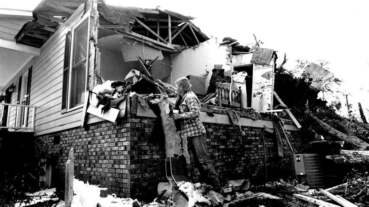 
Horne of Rhonda & Woody Ard at 6200 Tam Yard Rd. in Western Union CoÇ Their son Courtney 6mts. was killed when a tree crashed through his bedroom during Hugo. Several shots of the damaged home, couple shots of Woody beside Courtney's bedroom lifting up a part of the crib which was at the corner of the room. Woody & Rhonda's bedroom is to the right, also lots of damage. (THE ROOM WITH THE TREE INSIDE IS THE PARENTS BEDROOM)
