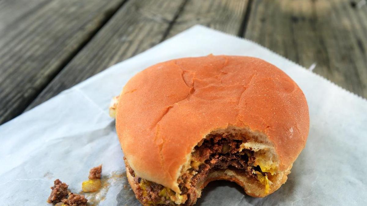 The famous cheeseburger, all the way, at Brooks Sandwich House on N. Brevard St. in NoDa: It comes with cheese, chili, mustard and onions.