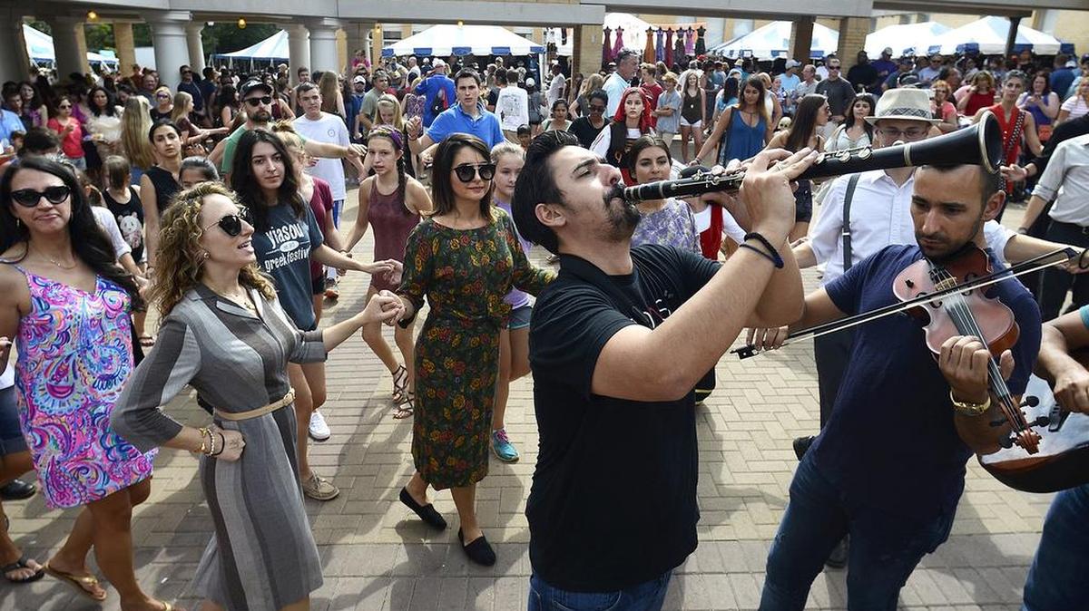 At least 200 dancers and audience members took part in a flash mob of traditional Greek dance at the Yiasou Greek Festival in 2016.