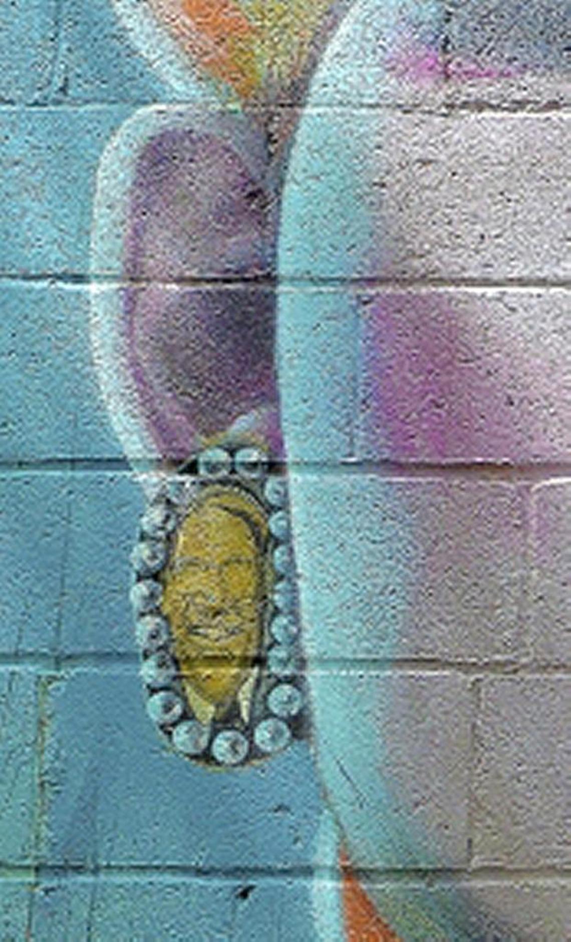 N.C. Gov. Pat McCrory’s face appears on the earrings Brandy Alexander wears on the mural.