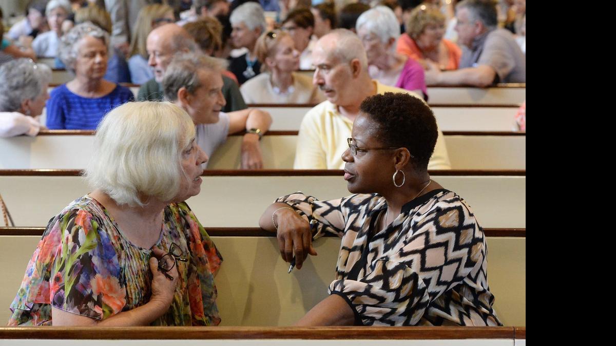 
Yvette Wilson, left, amd Ali Kavadlo were among those who attended a Monday conversation about race, violence and the Charleston tragedy. The event, spsonored by MeckMin, was held in Belk Chapel at Queens University of Charlotte. The interfaith group will have similar conversations at different locations every Monday through August.
