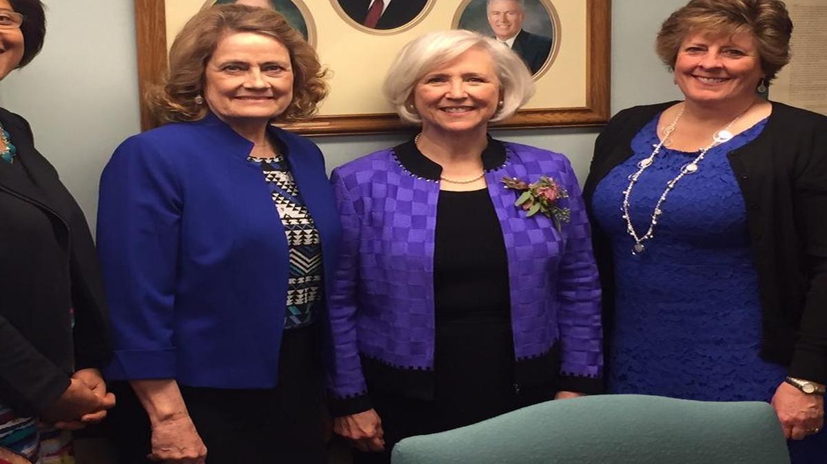 Neill Marriott, second from right, stands with members of the Charlotte South Stake Relief Society Presidency: Valerie Johnson, Jan Roberts, and Peggy Scott.
