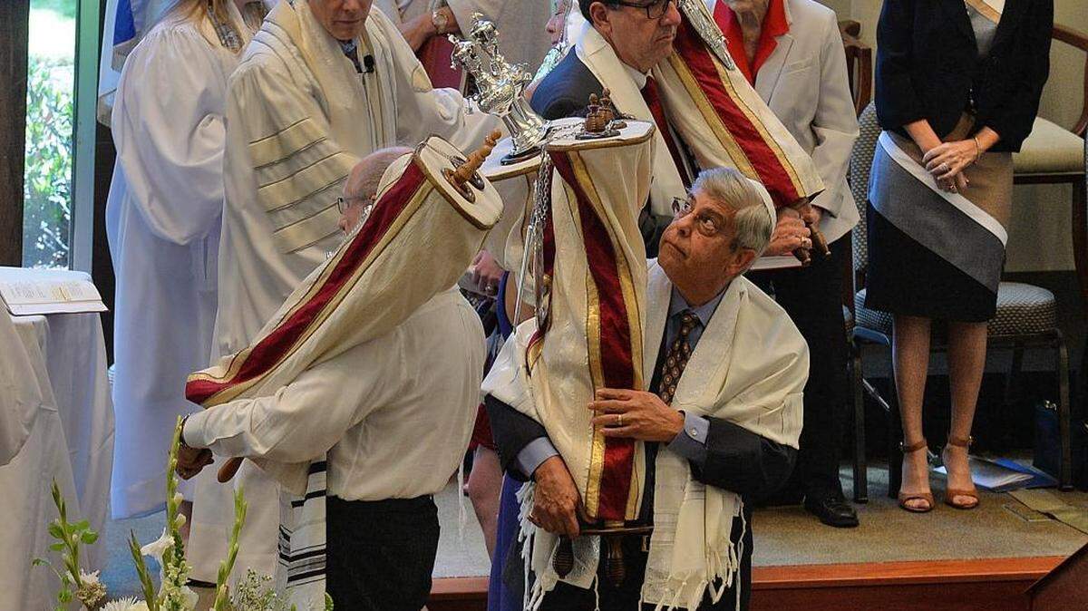 
During Monday’s Rosh Hashana service at Charlotte’s Temple Beth El, Torahs – sacred parchment scrolls containing the first five books of the Hebrew Bible – were carried out to the congregation. Members reverently touched them with a tallit (prayer shawl) or prayer book.
