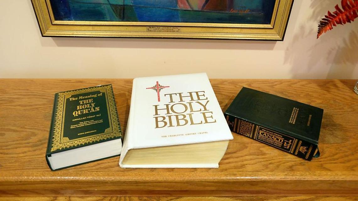 From left, the Quran, the Christian Bible, and the Torah on the altar in the chapel at Charlotte Douglas International Airport in 2013.
