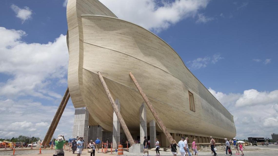 Visitors pass outside the front of a replica Noah's Ark at the Ark Encounter theme park during a media preview day, Tuesday, 2016, in Williamstown, Ky.