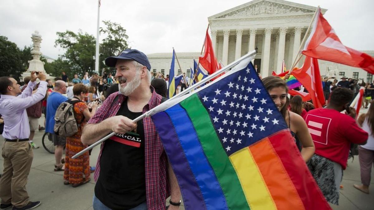 In this June 26, 2015 photo, supporters celebrate outside the Supreme Court in Washington after the court declared that same-sex couples have a right to marry anywhere in the United States.