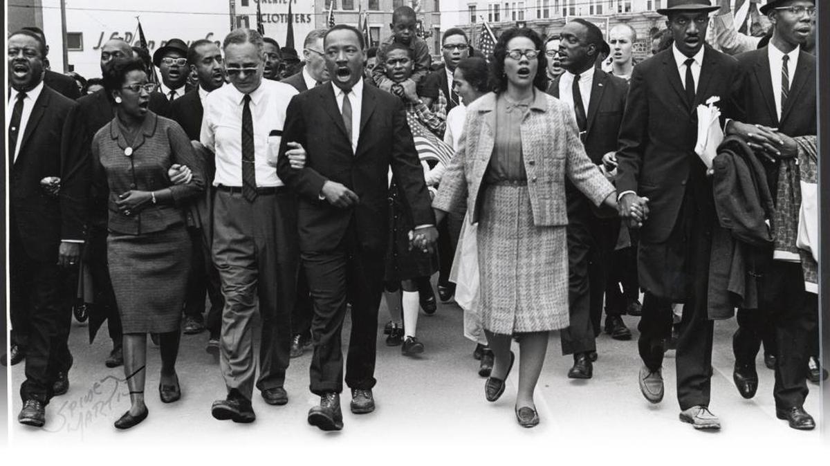 Dr. Martin Luther King Jr. joins with wife Coretta and supporters in 1965 to push for voting rights for African-Americans during the historic march from Selma to Montgomery in Alabama.