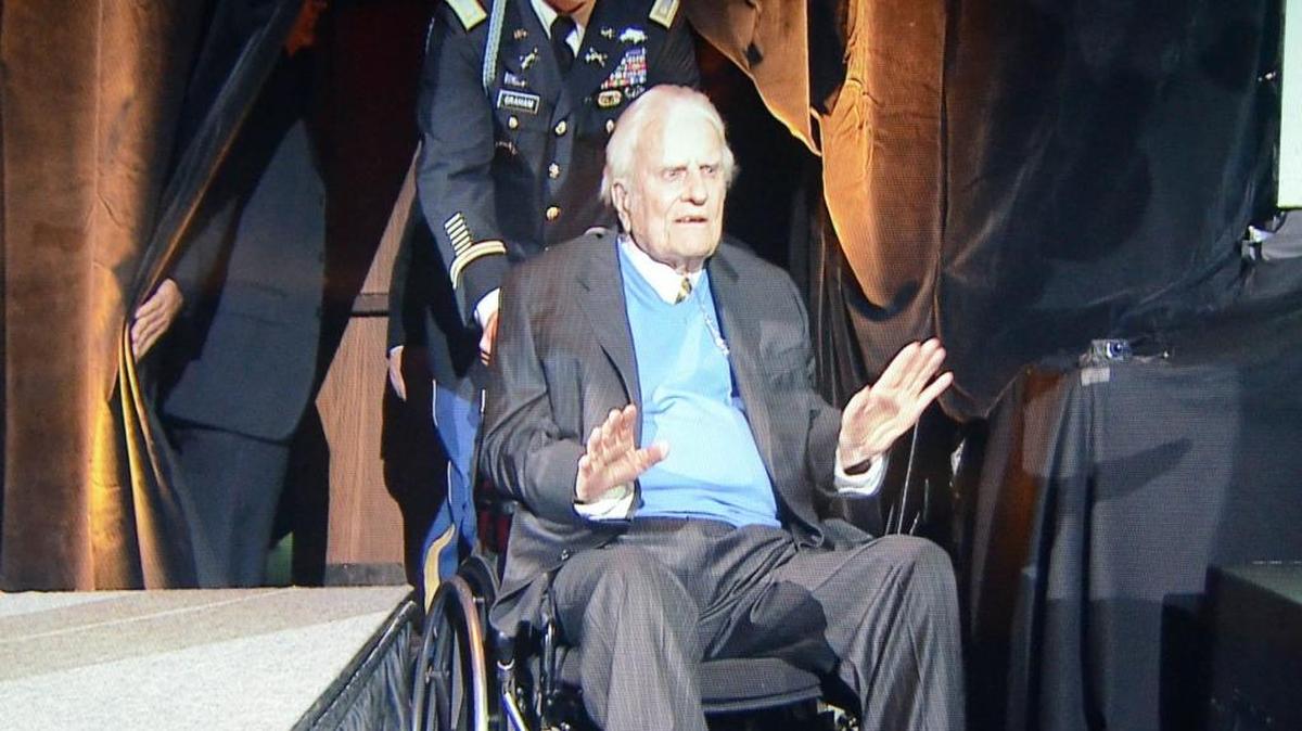 In 2013, Billy Graham arrives in the ballroom at the Grove Park Inn for a celebration of his 95th birthday.