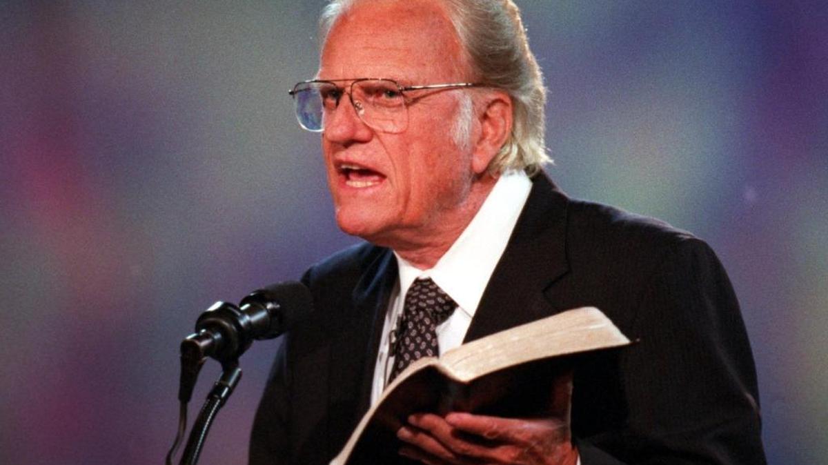 Charlotte-born evangelist Billy Graham preaches during his last hometown crusade in 1996. Graham died in 2018 at age 99.