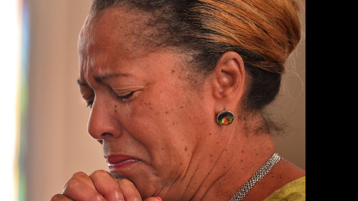
Jean Hawkins participates in a prayer of forgiveness during a service at the Mount Moriah Baptist Church in Spartanburg on June 20, in honor of those shot and killed in a Charleston church days earlier.

