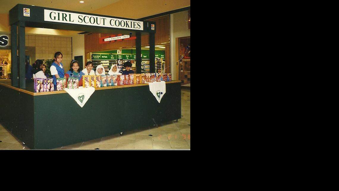 
Girl Scout troop 1101, which was led by Rose Hamid, selling cookies at Eastland Mall in 1998.
