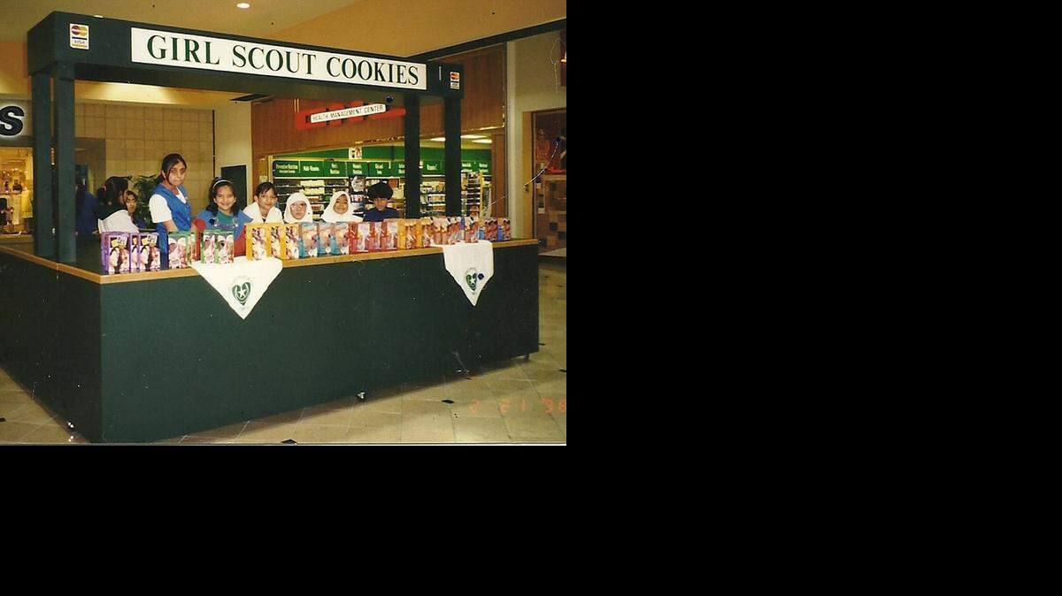 
Girl Scout troop 1101, which was led by Rose Hamid, selling cookies at Eastland Mall in 1998.
