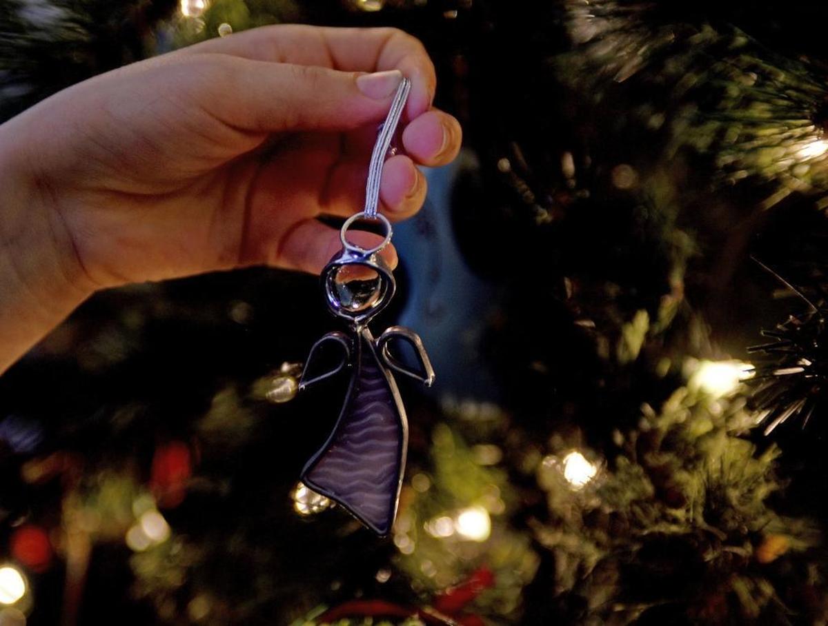 Madelyn Huffman holds an angel tree ornament given to her by a neighbor in appreciation for the 9-year-old girl’s toy drive for kids at Charlotte’s Levine Children’s Hospital.
