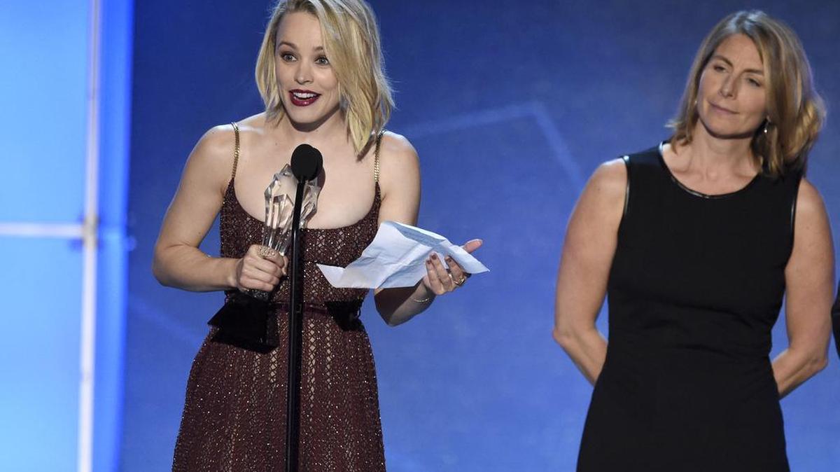 Actress Rachel McAdams, left, and journalist Sacha Pfeiffer accept the award for best acting ensemble for the movie “Spotlight” at the 2016 Critics' Choice Awards. McAdams portrayed Pfeiffer, a member of the Boston Globe’s Spotlight investigative reporting team, in the film that also won the Academy Award for Best Picture.